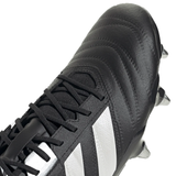 Close-up of the Core Black/Zero Metallic/Gold Metallic adidas Kakari RS SG soccer cleat with metal studs, showcasing a lace-up design, textured upper surface, and lightweight Fasttech material.