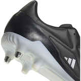 Close-up of an adidas RS15 SG rugby boot in Core Black/Zero Metallic/White, showcasing Sprintframe stability and white, metal-tipped cleats on the sole.