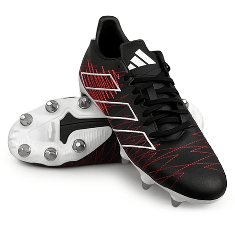 Core Black/Core Black/Better Scarlet adidas Kakari Elite SG 24 cleats with white accents and metal studs on the sole, one standing upright and the other lying on its side. These lightweight rugby boots from adidas are perfect for soft ground conditions.