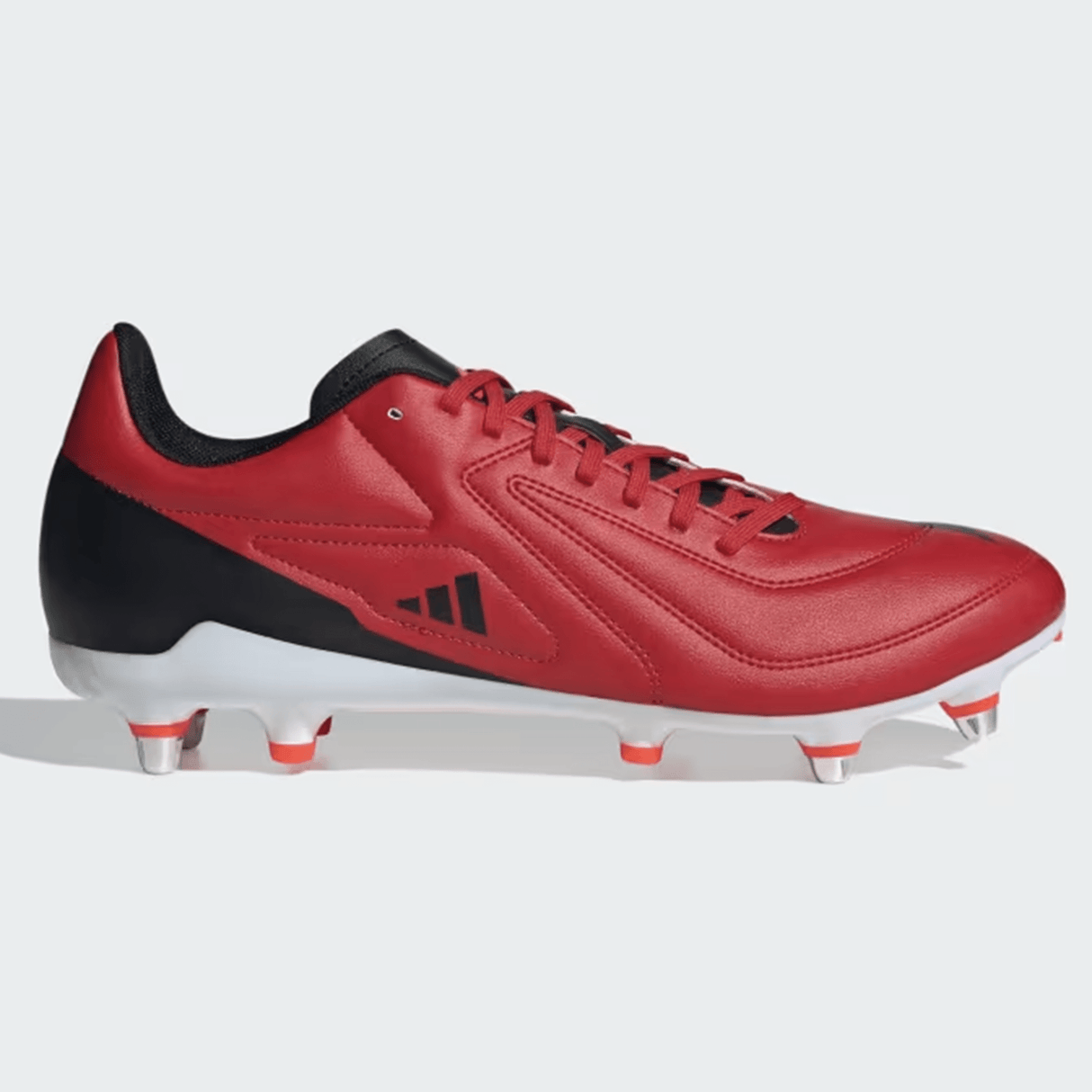 The adidas RS15 SG 24 - Better Scarlet/Core Black/Solar Red Rugby Cleat showcases a striking red and black design with a lightweight synthetic forefoot, black interior, red laces, and metal studs on the Speedframe outsole.