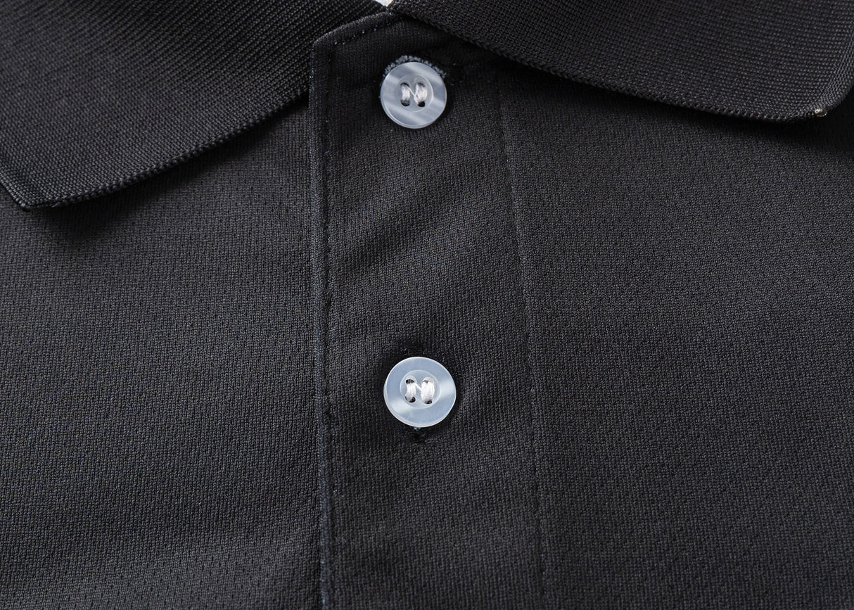 A detailed view of the Hurricanes Super Rugby 25/26 Team Polo by Classic Sportswear showcases a textured black fabric, classic sportswear style, and two contrasting white buttons.