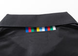 The Hurricanes Super Rugby 25/26 Team Polo by Classic Sportswear features a black shirt collar adorned with multicolored square tabs, adding a classic sportswear touch.