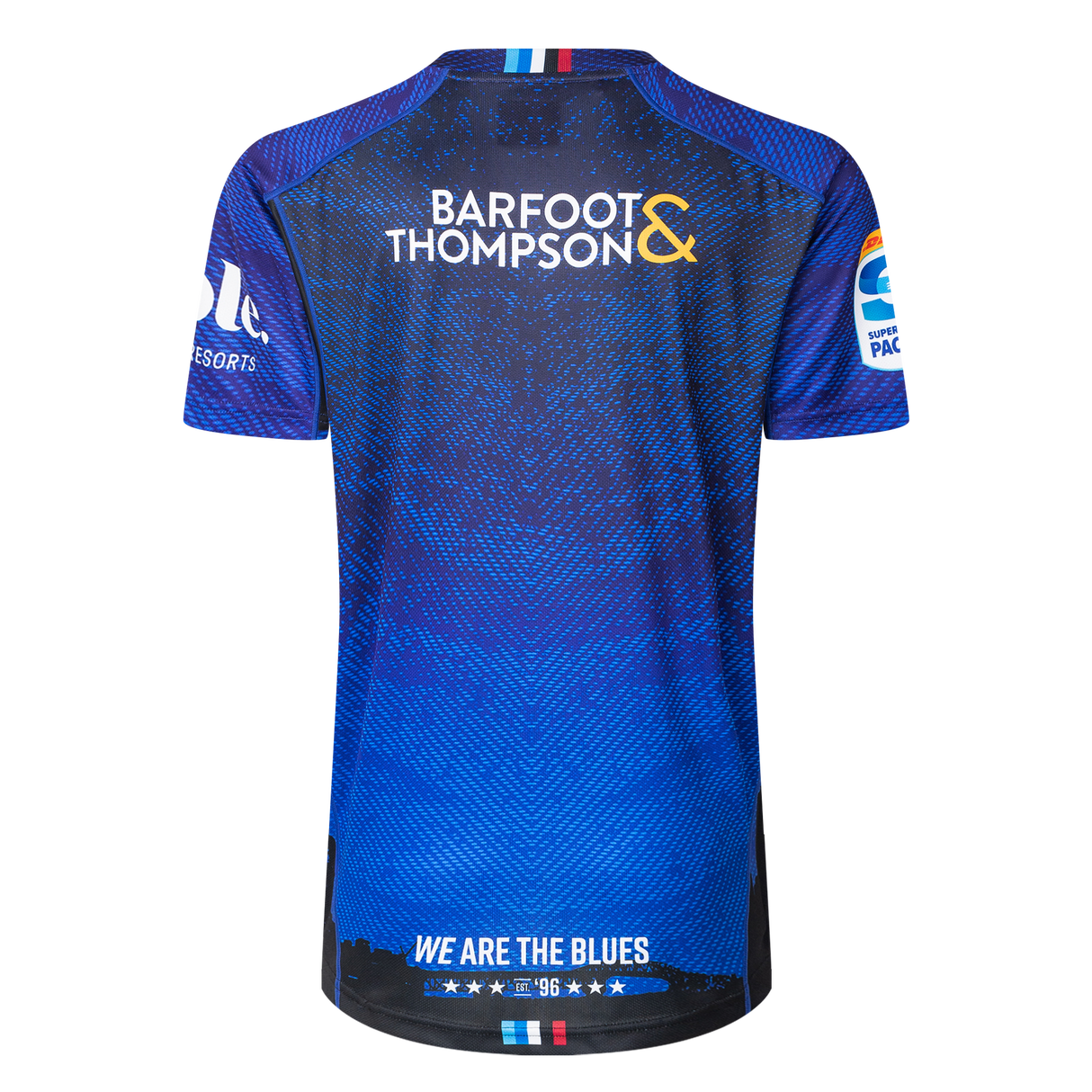 The back of the Blues Super Rugby 25/26 Replica Home Jersey by Classic Sportswear displays "Barfoot & Thompson" prominently. It features logos on both sleeves, and "We Are the Blues" at the bottom, embodying the Blues spirit.