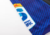 Close-up of a blue Blues Super Rugby 25/26 Replica Home Jersey by Classic Sportswear, with the DHL logo and "Rugby Pacific" emblem on white. Designed for true fans, this garment captures the Blues' spirit.