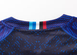 A close-up of the upper back of the Blues Super Rugby 25/26 Replica Home Jersey by Classic Sportswear shows blue dots and a vertical blue, white, and red stripe—ideal for fans who love classic sportswear style.