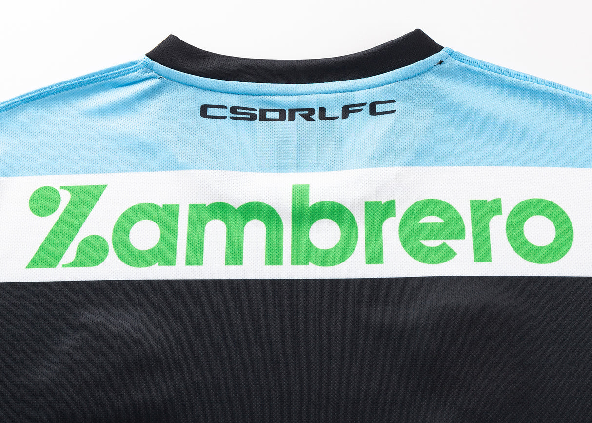 Close-up of the back of a Sharks NRL 25/26 Replica Home Jersey by Classic Sportswear in light blue and black, with "CSDRLFC" at the top and "Zambrero" in green across the middle.