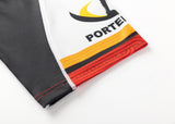 Close-up of the Gallagher Chiefs Super Rugby Replica Away Jersey 25/26 sleeve shows a black and yellow partial logo, "PORTEI," and a red-orange hem. The black and white sleeve mirrors Super Rugby's Gallagher Chiefs iconic style. Brand: Classic Sportswear.