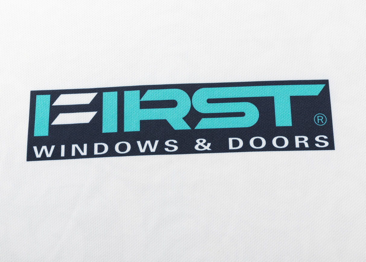 Logo on a white surface with the text "FIRST WINDOWS & DOORS" in bold, featuring a stylized "F" design, reminiscent of the unique branding seen on the Gallagher Chiefs Super Rugby Replica Away Jersey 25/26 by Classic Sportswear.