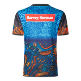 The NRL Indigenous All Stars 25/26 Replica Home Jersey by Classic Sportswear features a vibrant back view with abstract blue and orange patterns, and the "Harvey Norman" logo, capturing classic sportswear spirit—a standout for fans and collectors.