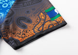 A close-up of the NRL Indigenous All Stars 25/26 Replica Home Jersey by Classic Sportswear shows abstract multicolored patterns, featuring swirls, dots, and a small flag element in a classic sportswear design.