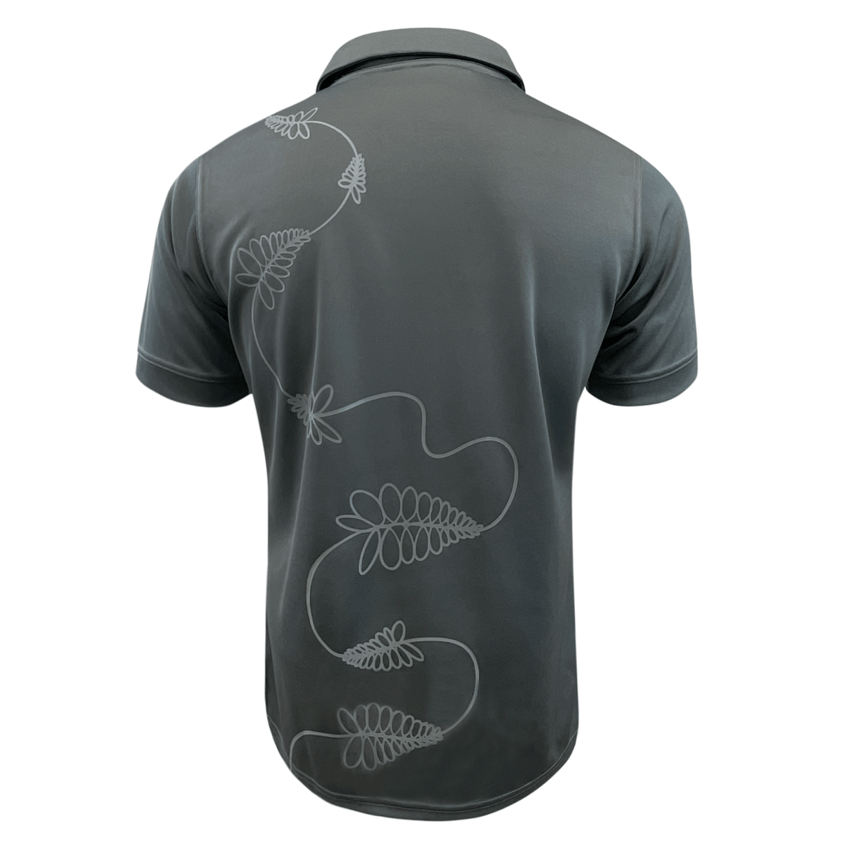 The All Blacks Training Jersey by adidas is a dark-colored polo shirt showcasing a light-colored, abstract floral design reminiscent of a French Fern that extends from the lower left to the upper right on the back.