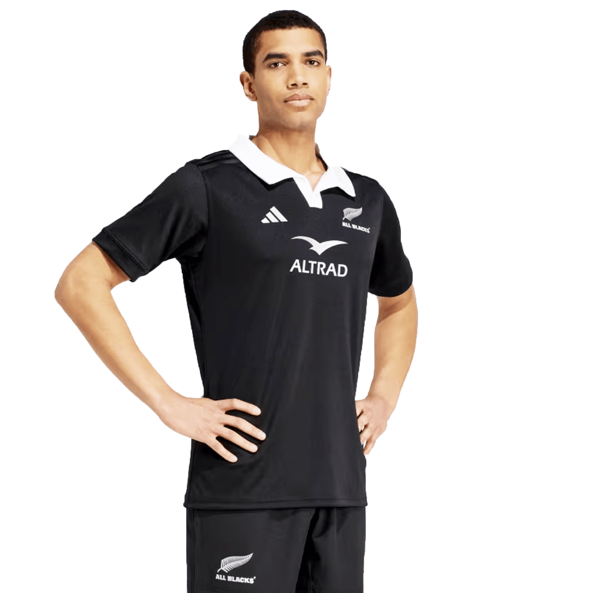 Person modeling the All Blacks 24/25 Home Supporters Jersey by adidas, featuring "ALTRAD" and "ALL BLACKS" logos, showcasing the sleek design and AEROREADY technology for optimal performance.