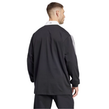 Man in black adidas track jacket featuring white collar and sleeve stripes, reminiscent of the sleek design of the All Blacks 24/25 Culture Jersey by adidas, seen from behind.