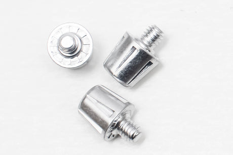 A pair of chrome screws, measuring Starlai Corp WRS M6 Studs, on a white surface.