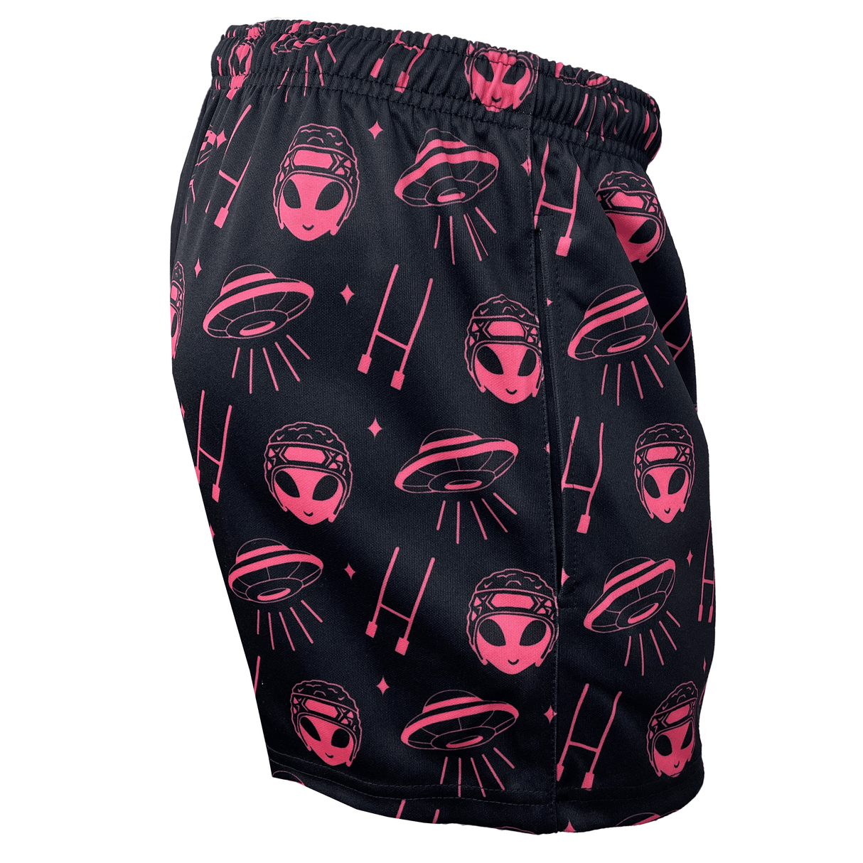 Explore the Modish Rugger Limited Edition "We Scrum in Peace" Rugby Shorts, showcasing playful pink alien faces and flying saucer patterns on sleek black fabric. These unisex shorts seamlessly blend style and comfort, making them an exceptional addition to any wardrobe.