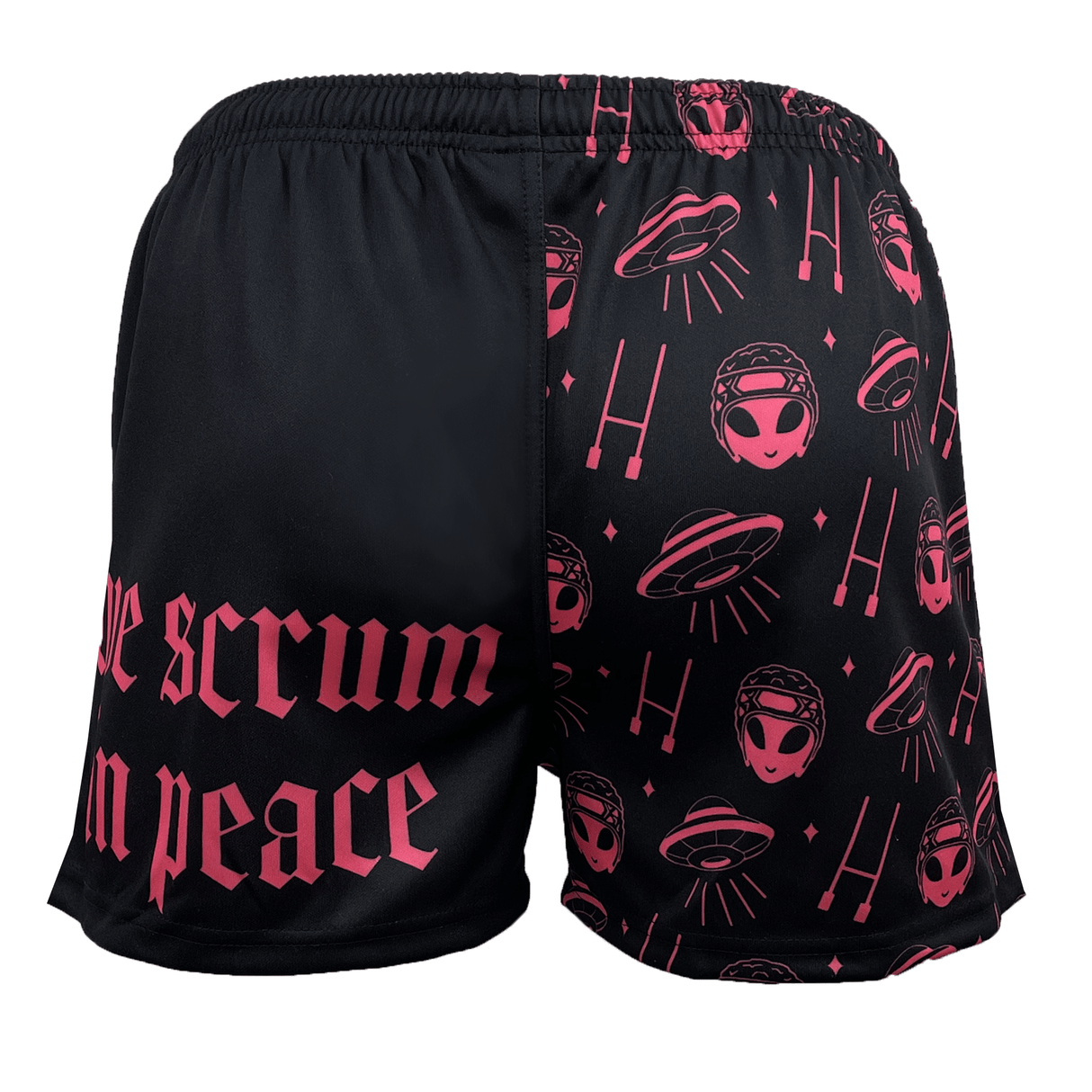 Introducing the Modish Rugger Limited Edition "We Scrum in Peace" Rugby Shorts by Modish Rugger: Unisex black and pink shorts adorned with alien and UFO patterns on one side, and emblazoned with "We scrum in peace" text on the other. Perfect for any fan!