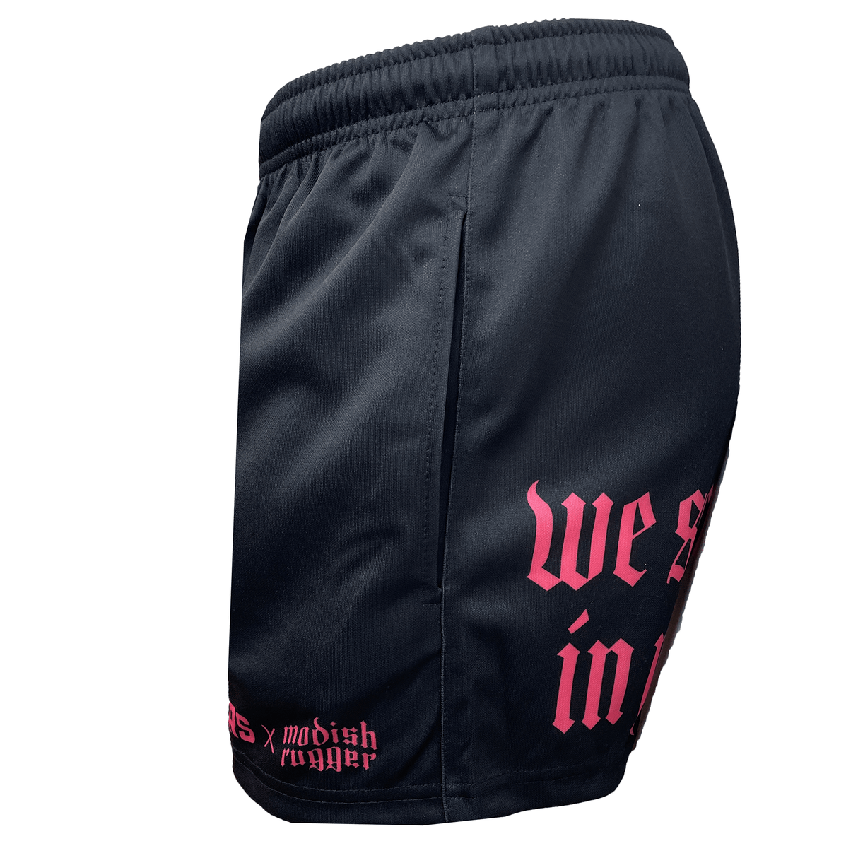 Introducing the Modish Rugger Limited Edition "We Scrum in Peace" Rugby Shorts by Modish Rugger. These black athletic shorts, featuring pink gothic text on the side and logos near the hem, are designed to be perfectly unisex. They offer versatility for both casual outings and rugby practice sessions.