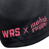 Close-up of black fabric with pink text "WRS x Modish Rugger" printed on it, highlighting our limited edition unisex collection of Modish Rugger Limited Edition "We Scrum in Peace" Rugby Shorts.