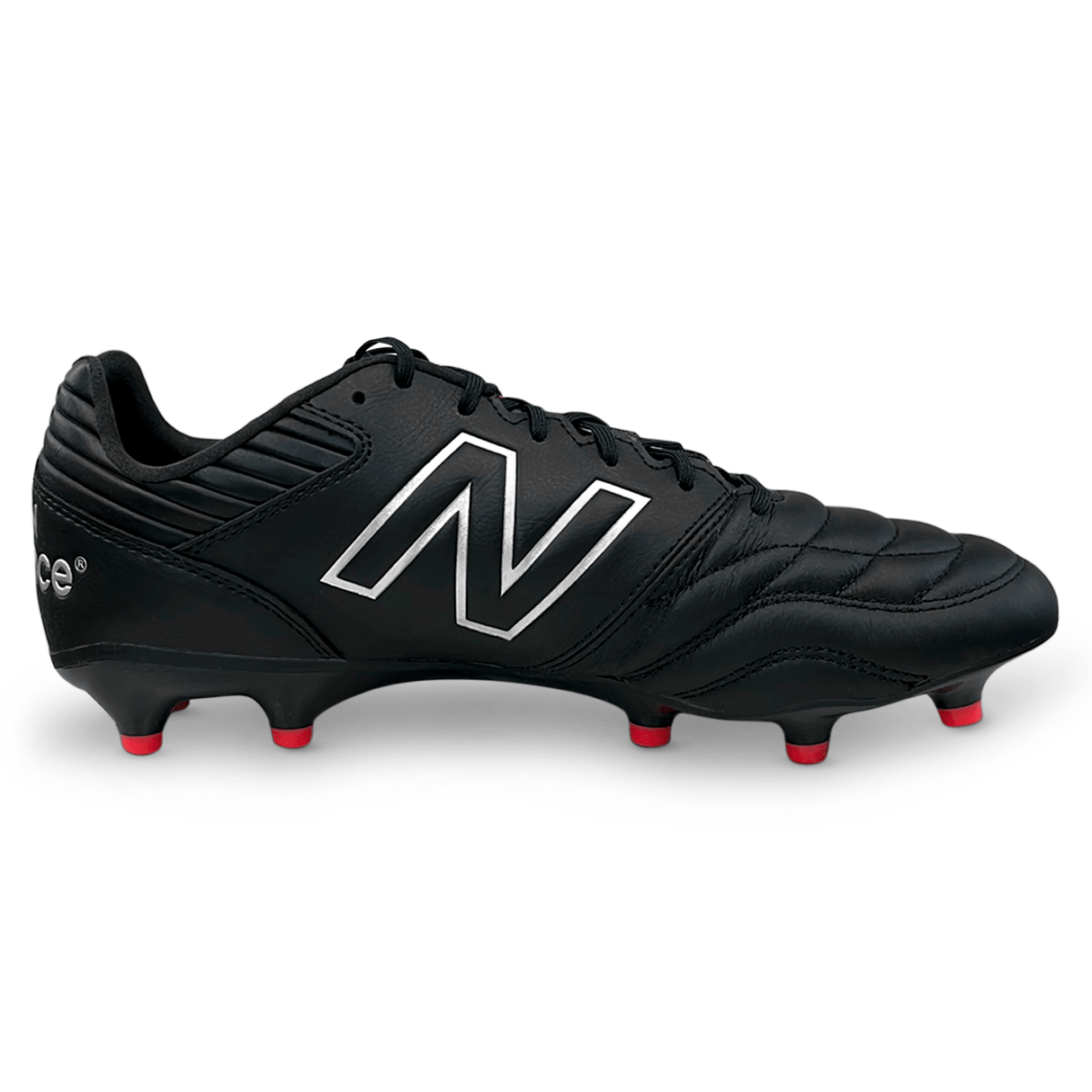 Side of New Balance black rugby boot with quilted toe, black laces, red studs and N logo on the side. 