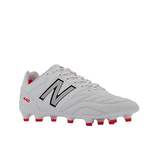 The New Balance Wide 442 V2 Pro FG in White/Silver is a soccer cleat featuring a kangaroo leather upper with black and red accents, including a large "N" logo on the side and "442" printed near the heel. Designed for firm ground play, the sole includes red studs for optimal traction.