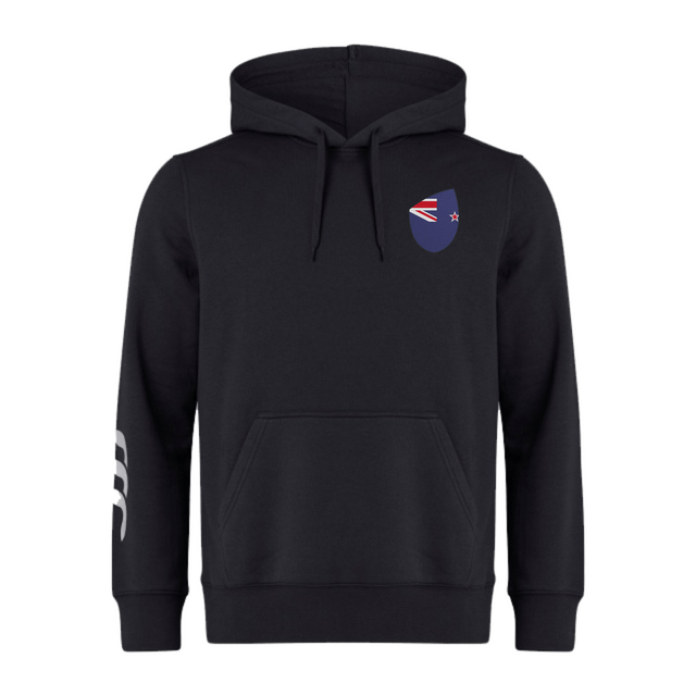 The New Zealand Shield Club Hoodie from EMB Canterbury features a drawstring hood, small NZ flag logo on the chest, and three white stripes on the right sleeve. This black hoodie is ideal for rugby fans, capturing the spirit and style of Canterbury.