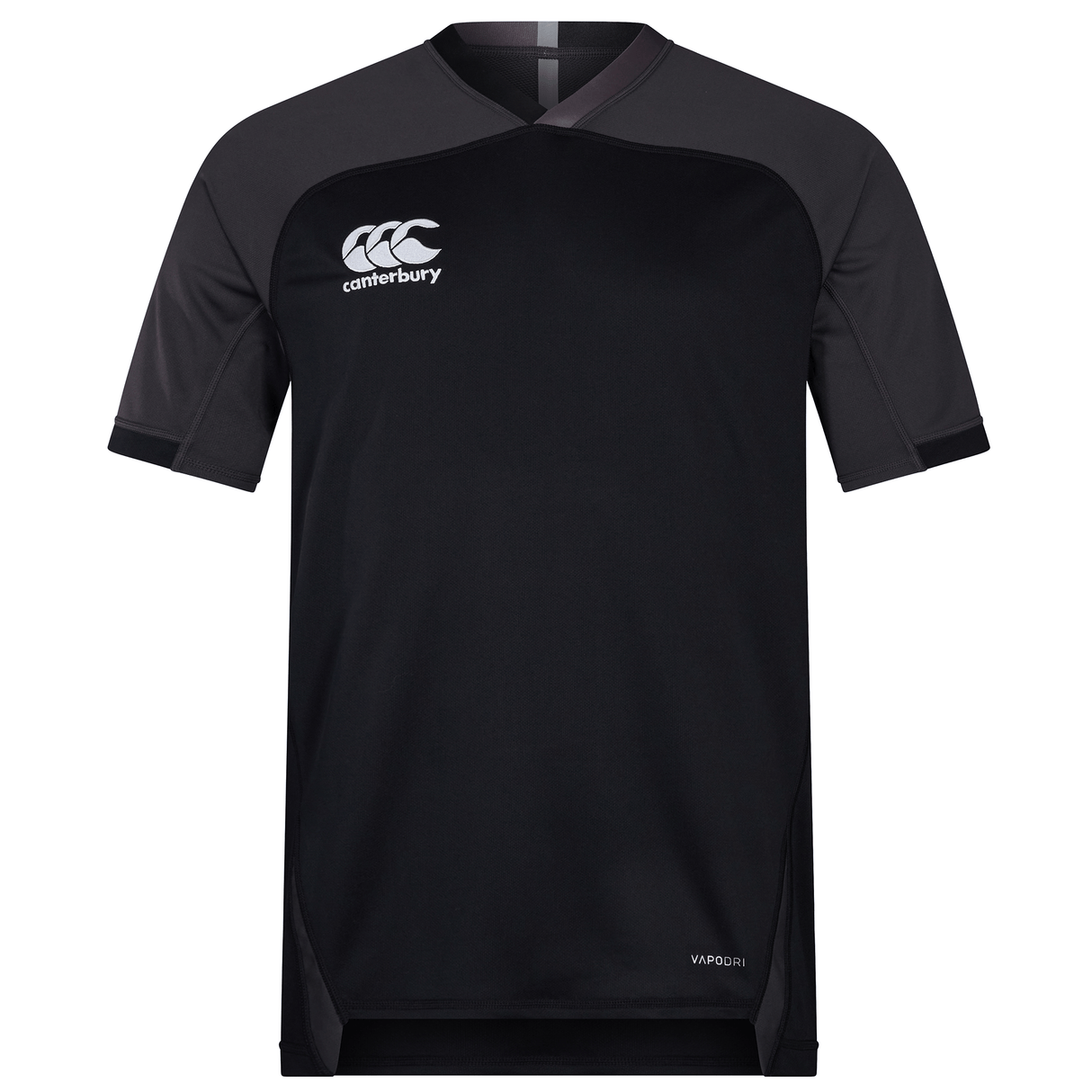 The Canterbury Vapodri Evader Jersey is a black short-sleeve jersey featuring contrasting dark grey shoulder panels. The Canterbury logo adorns the left chest, and "VapoDri" is printed on the lower right side, highlighting its moisture-wicking technology.