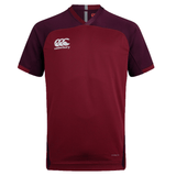 A Canterbury Vapodri Evader Jersey, maroon and short-sleeved with the iconic Canterbury logo on the chest, featuring a VapoDri finish for enhanced moisture-wicking technology.