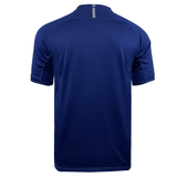 Back view of the Canterbury Vapodri Evader Jersey, a plain blue short-sleeve athletic shirt featuring Canterbury's VapoDri finish and a small reflective strip near the neckline.