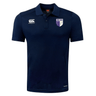 The OMBAC Rugby Club Dry Polo by EMB Canterbury features a navy blue short-sleeve design with a white embroidered logo on the left sleeve, a crest on the left chest, and breathable fabric utilizing Vapodri Technology for quick drying.