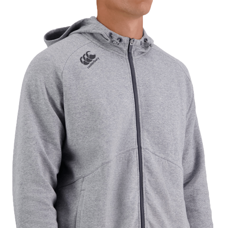 A man wearing a Canterbury Tempo Vapodri Full-Zip Hoodie with Canterbury branding.