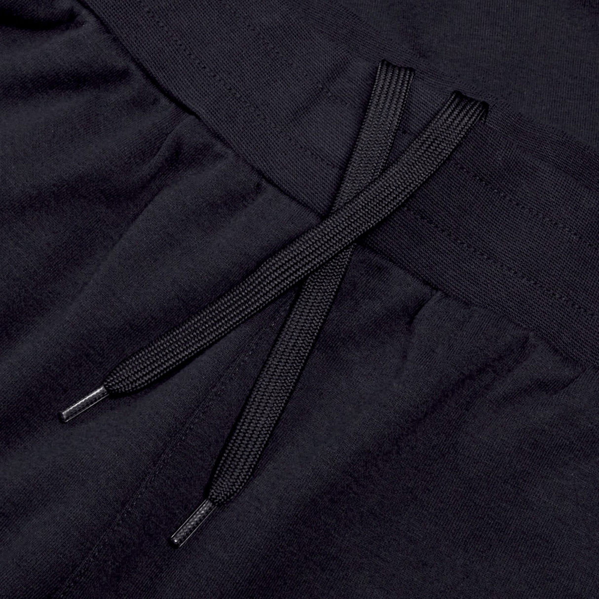 Close-up of a pair of black Ireland 24 Fleece Shorts by Canterbury, reminiscent of classic Canterbury rugby shorts, showing the waistband and tied drawstrings.