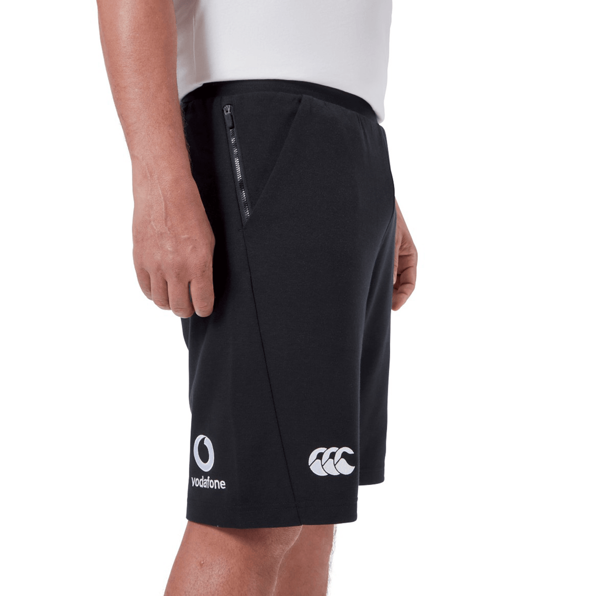 Individual wearing the Ireland 24 Fleece Short by Canterbury with brand logos, standing against a white background.