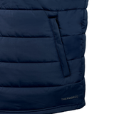 Close-up of the Samoa Shield Core Gilet by EMB Canterbury, a navy blue padded jacket with horizontal stitching and a side pocket. It features Thermoreg insulation, with "THERMOREG" printed near the hem for added distinction.