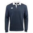 The Canterbury CCC Solid Dye Long Sleeve Rugger is a navy blue rugby shirt with long sleeves, designed for a relaxed fit and featuring a white collar and chest logo. Crafted from a comfortable cotton/poly blend, it is ideal for both casual wear and sports activities.