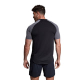 The back view of a man wearing a Canterbury Elite Training Tee.