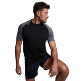 A man wearing a Canterbury Elite Training Tee by Canterbury.