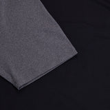 A Canterbury Elite Training Tee, in a grey color, against a black background.