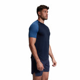 A man wearing a Canterbury Elite Training Tee in blue.