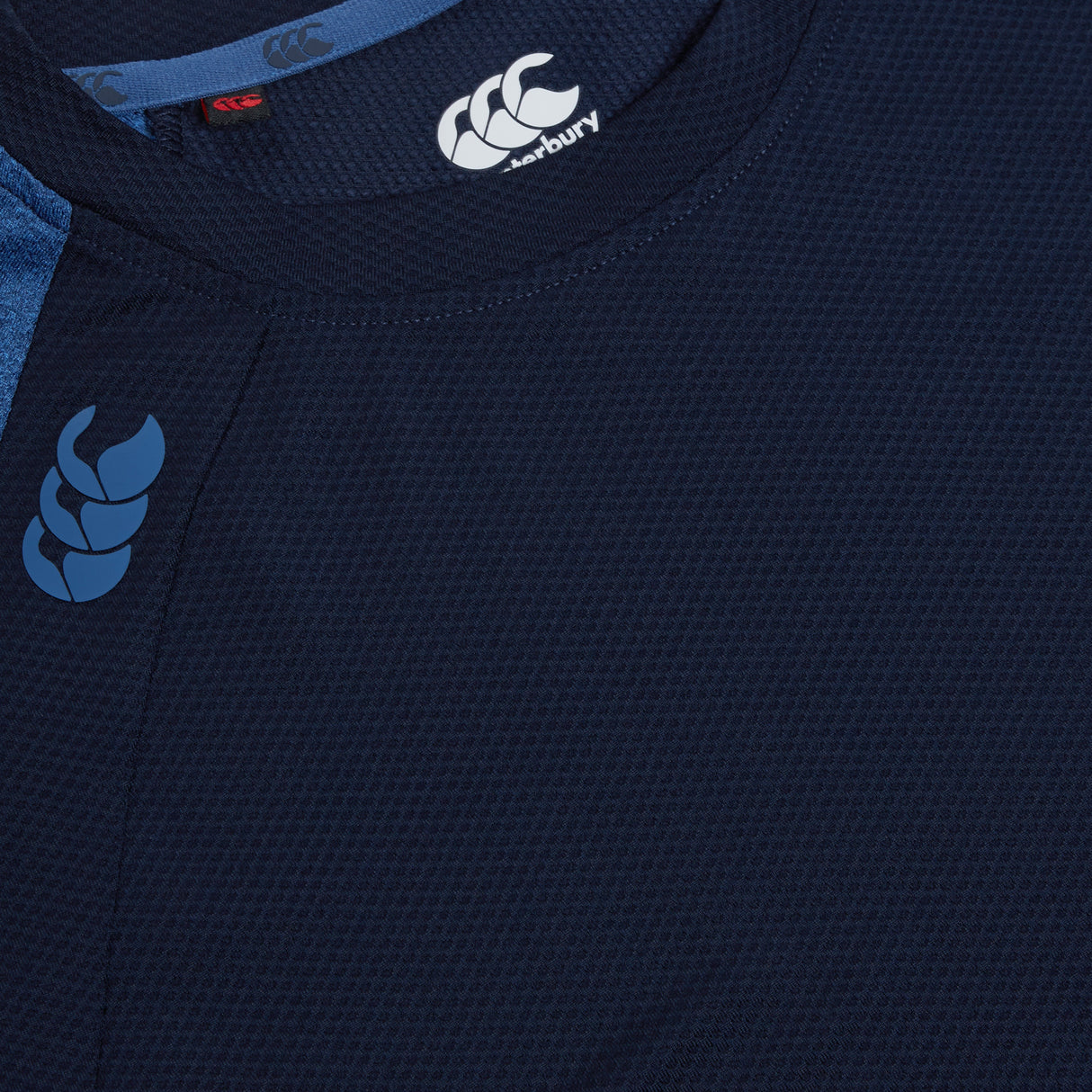 A close up of a Canterbury Elite Training Tee in navy blue by Canterbury.