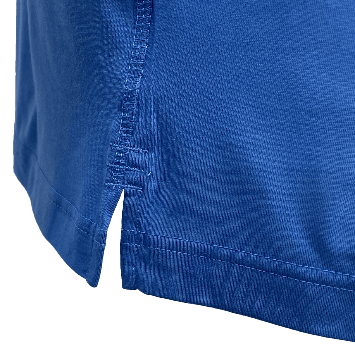 Close-up of a blue Canterbury fabric with visible stitching and a small side slit, showcasing the texture and craftsmanship of the Canterbury Sports Dept. Logo T-Shirt.