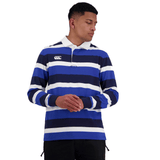 A man wearing a Canterbury Fundamentals Striped Long Sleeve Rugby Jersey with a cotton drill collar and a prominent logo on the chest.