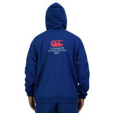 Person wearing the Canterbury Legends Woven 1/4 Zip in blue, featuring "Canterbury of New Zealand 120 years" and a logo printed on the back, effortlessly blending sports casualwear style.