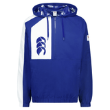 The Canterbury Legends Woven 1/4 Zip by Canterbury is a stylish blue and white pullover jacket that features a hood and a convenient kangaroo pocket. It stands out with its prominent chest logo and elastic cuffs, combining the best of sports casualwear with comfort and style.