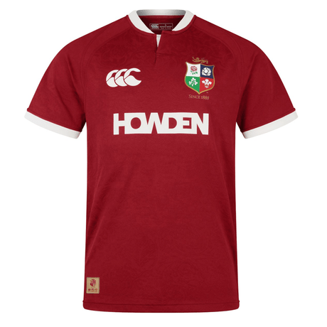 The British & Irish Lions 2025 Players Jersey by Canterbury boasts a red design accented with a white collar and sleeve trim. It features "HOWDEN" and logo designs on the front, with moisture-wicking fabric to ensure comfort as you cheer for your favorite team.