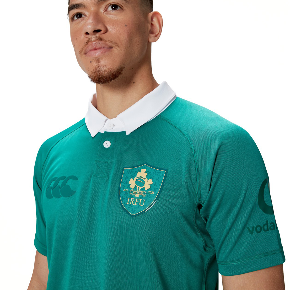 A person proudly wears the Ireland 150th Anniversary Pro Home Jersey by Canterbury, which features the IRFU emblem on the chest. Engineered with Vapodri Technology, it guarantees optimum comfort and performance.