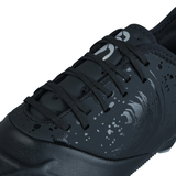 Close-up of the Canterbury Phoenix Genesis Pro SG - Black/Silver Metallic by Canterbury, an athletic shoe in a sleek black with black laces and a sophisticated silver pattern on the upper section, meticulously designed for ultimate traction on soft ground.