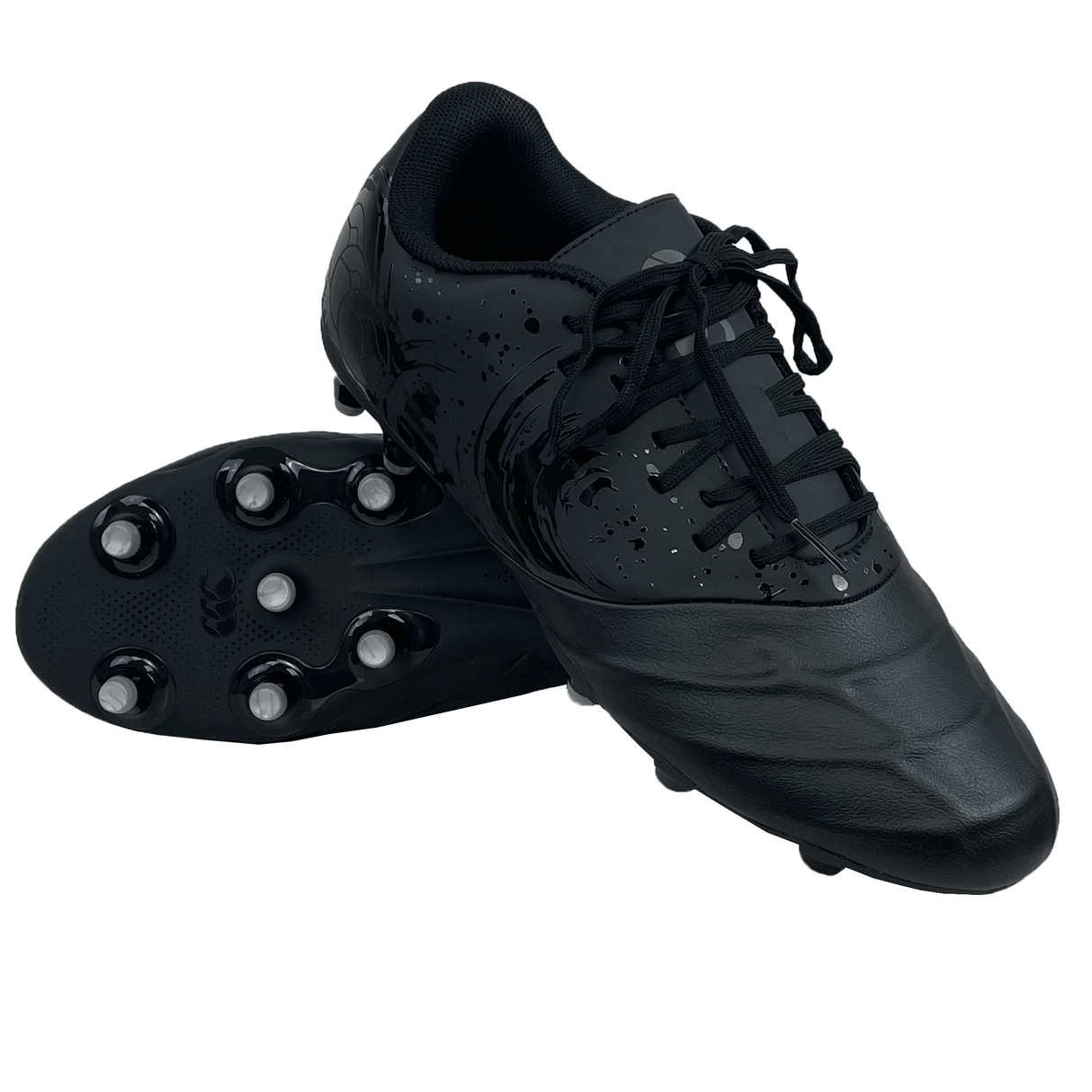 A pair of Canterbury Phoenix Genesis Team FG cleats in Black/Silver Metallic, featuring a synthetic leather forefoot. One cleat rests on its side showcasing the firm ground boot's sole and studs, while the other shoe stands upright.