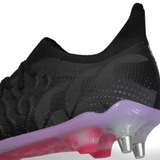 The Canterbury Speed Infinite Elite SG - Black/Verbena soccer shoe features lightning-quick acceleration with its black and purple design, emphasized by the striking pink sole.