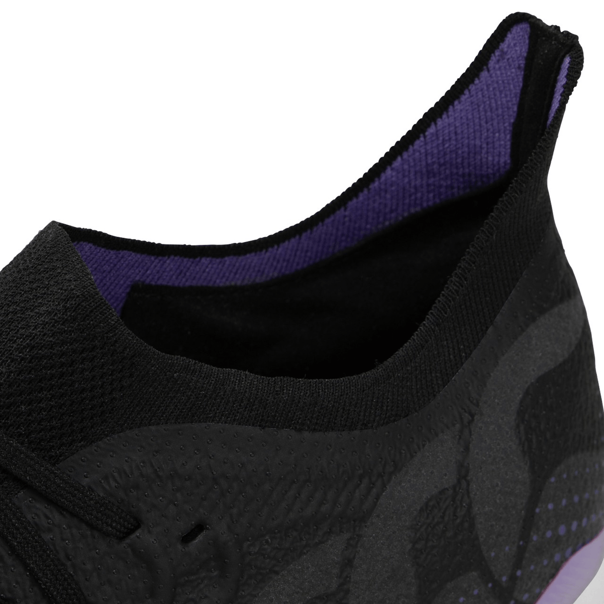 The Canterbury Speed Infinite Elite SG - Black/Verbena is a lightning-quick black and purple running shoe with advanced acceleration, featuring a vibrant purple sole.