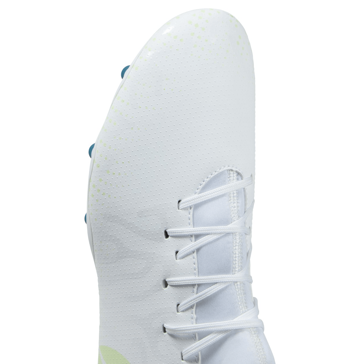 Close-up of a white Canterbury Speed Infinite Team FG rugby boot with laces and green accents.